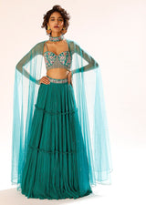 Teal Tiered Skirt And Bustier Set With Colorful Resham Embroidery And Choker With Attached Net Cape